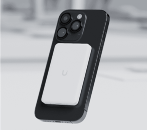 Picture of a WiFiman Wizard attached to the back of an Apple iPhone using MagSafe